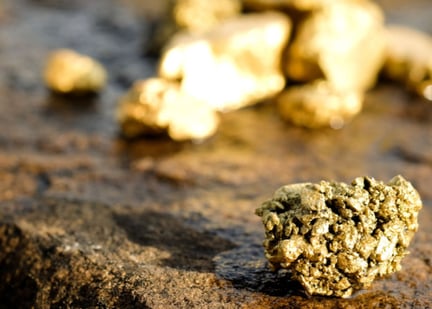 gold ore sitting on stone